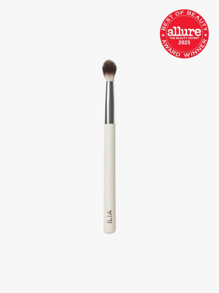 ILIA Beauty Blending Brush with white and silver handle on light gray background with red Allure Best of Beauty seal in the top right corner